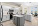 Spacious kitchen with stainless steel appliances and an island at 3702 Gaviota Dr, Ruskin, FL 33573