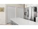 Kitchen boasts an island with white cabinets and stainless steel fridge at 3702 Gaviota Dr, Ruskin, FL 33573