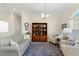 Relaxing living room with two armchairs and a wood bookcase at 3702 Gaviota Dr, Ruskin, FL 33573