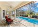 Relaxing screened pool area with patio furniture, offering a tranquil outdoor space at 3702 Gaviota Dr, Ruskin, FL 33573