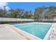 Community swimming pool with surrounding landscaping at 3958 Dream Oak Pl # 104, Tampa, FL 33613
