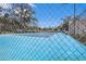 Community tennis court with chain-link fencing at 3958 Dream Oak Pl # 104, Tampa, FL 33613