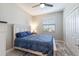 Bright bedroom with a full bed and double door closet at 5211 Marina Basin Ct, Bradenton, FL 34211