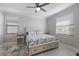 Spacious bedroom with a queen-size bed, nightstands, and large windows at 5211 Marina Basin Ct, Bradenton, FL 34211