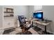 Home office with an adjustable desk, comfortable chair, and built-in shelving at 5211 Marina Basin Ct, Bradenton, FL 34211