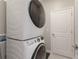 Laundry room with a stacked washer and dryer at 5211 Marina Basin Ct, Bradenton, FL 34211