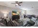 Living room with sectional sofa, large TV, and dining area at 5211 Marina Basin Ct, Bradenton, FL 34211