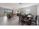 Spacious living room with a sectional sofa, large TV, and dining area at 5211 Marina Basin Ct, Bradenton, FL 34211