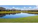 Tranquil pond reflecting the homes and sky at 5211 Marina Basin Ct, Bradenton, FL 34211