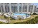 Refreshing swimming pool area with lounge chairs at 6009 Sea Ranch Dr # 303, Hudson, FL 34667