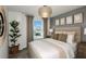 Guest bedroom with neutral decor and large window at 6211 Golden Beach Dr, Apollo Beach, FL 33572
