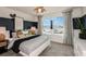 Bright bedroom with a king-size bed and stylish decor at 6211 Golden Beach Dr, Apollo Beach, FL 33572