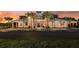 Community clubhouse at dusk with landscaping and parking at 6211 Golden Beach Dr, Apollo Beach, FL 33572