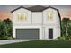 Two-story house with gray garage door and landscaping at 6211 Golden Beach Dr, Apollo Beach, FL 33572
