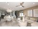 Open living room and dining area with neutral decor at 6211 Golden Beach Dr, Apollo Beach, FL 33572