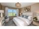 Spacious main bedroom with a large window and neutral decor at 6211 Golden Beach Dr, Apollo Beach, FL 33572