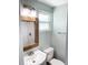 Clean bathroom with a white vanity, a wicker mirror, and neutral color scheme at 690 Fox St, Longboat Key, FL 34228