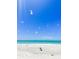 Stunning beach view with white sand and clear water at 690 Fox St, Longboat Key, FL 34228
