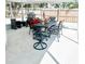 Outdoor patio with table, chairs, and screened enclosure at 690 Fox St, Longboat Key, FL 34228