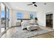 Spacious main bedroom with wood floors, a ceiling fan, and sliding glass doors to balcony at 808 W Adalee St, Tampa, FL 33603