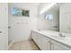 Bright bathroom with double vanity and large mirror at 8529 Alexandra Arbor Ln, Temple Terrace, FL 33637