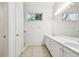 Clean bathroom featuring double sinks and a large mirror at 8529 Alexandra Arbor Ln, Temple Terrace, FL 33637