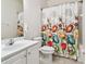 Bathroom with floral shower curtain and single vanity at 8529 Alexandra Arbor Ln, Temple Terrace, FL 33637