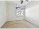 Bright bedroom with carpeted floor, window, and ceiling fan at 8529 Alexandra Arbor Ln, Temple Terrace, FL 33637