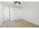 Bright bedroom with double door closet and ceiling fan at 8529 Alexandra Arbor Ln, Temple Terrace, FL 33637