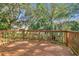 Wooden deck overlooking a lush, green backyard at 8529 Alexandra Arbor Ln, Temple Terrace, FL 33637