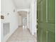 Bright and spacious entryway with tile flooring and access to other rooms at 8529 Alexandra Arbor Ln, Temple Terrace, FL 33637