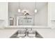 Kitchen with a breakfast bar and view into Gathering room at 8529 Alexandra Arbor Ln, Temple Terrace, FL 33637