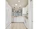 Efficient kitchen with white cabinets, ample counter space, and appliances at 8529 Alexandra Arbor Ln, Temple Terrace, FL 33637
