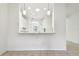 Kitchen features white cabinets and a breakfast bar at 8529 Alexandra Arbor Ln, Temple Terrace, FL 33637