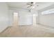 Large main bedroom with ceiling fan, carpet flooring, and ensuite bathroom at 8529 Alexandra Arbor Ln, Temple Terrace, FL 33637