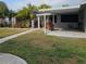 Backyard with covered patio and landscaping at 901 8Th Sw St, Ruskin, FL 33570