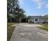 Single story home with carport and well maintained landscaping at 901 8Th Sw St, Ruskin, FL 33570