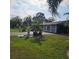 House exterior with palm trees and landscaping at 901 8Th Sw St, Ruskin, FL 33570