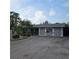 Gray house with landscaped yard and driveway at 901 8Th Sw St, Ruskin, FL 33570