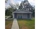 Detached guest house with covered porch and rocking chairs at 901 8Th Sw St, Ruskin, FL 33570