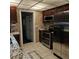 Stainless steel appliances and tile floor in kitchen at 901 8Th Sw St, Ruskin, FL 33570
