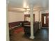 Living room with decorative columns and dark furniture at 901 8Th Sw St, Ruskin, FL 33570