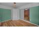 Spacious bedroom with light wood floors and ample closet space at 4140 55Th N St # 1211, Kenneth City, FL 33709