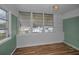 Light-filled bedroom with wood floors and multiple windows at 4140 55Th N St # 1211, Kenneth City, FL 33709