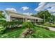 Community building exterior with landscaping at 4140 55Th N St # 1211, Kenneth City, FL 33709