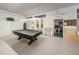 Community game room features billiard and ping pong tables at 4140 55Th N St # 1211, Kenneth City, FL 33709