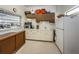 Small kitchen with appliances and ample storage, suitable for community use at 4140 55Th N St # 1211, Kenneth City, FL 33709