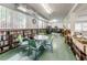 Community library with various bookshelves and a comfortable reading space at 4140 55Th N St # 1211, Kenneth City, FL 33709