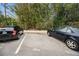 Assigned parking space in front of bamboo trees at 4140 55Th N St # 1211, Kenneth City, FL 33709