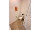 Small powder room with updated toilet at 10059 Crooked Creek Dr # 102, Venice, FL 34293